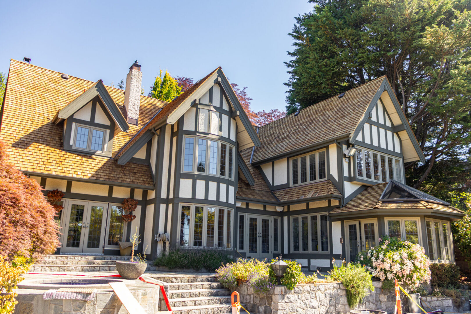 Large Tudor-style house with landscaped garden